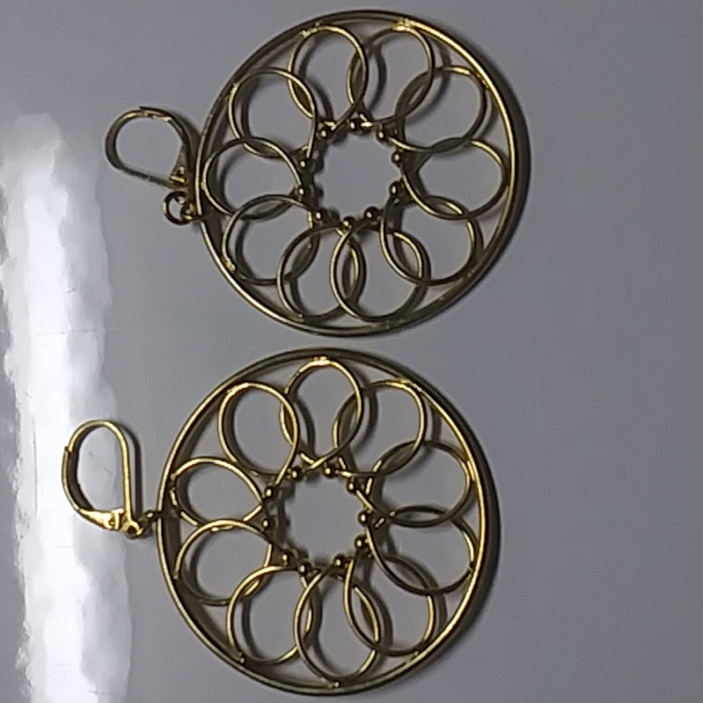 Gold plated design earrings. Must have pierced ears